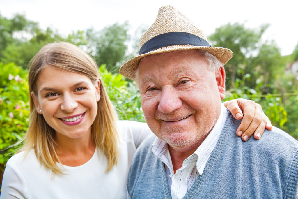 elderly man with daughter in park